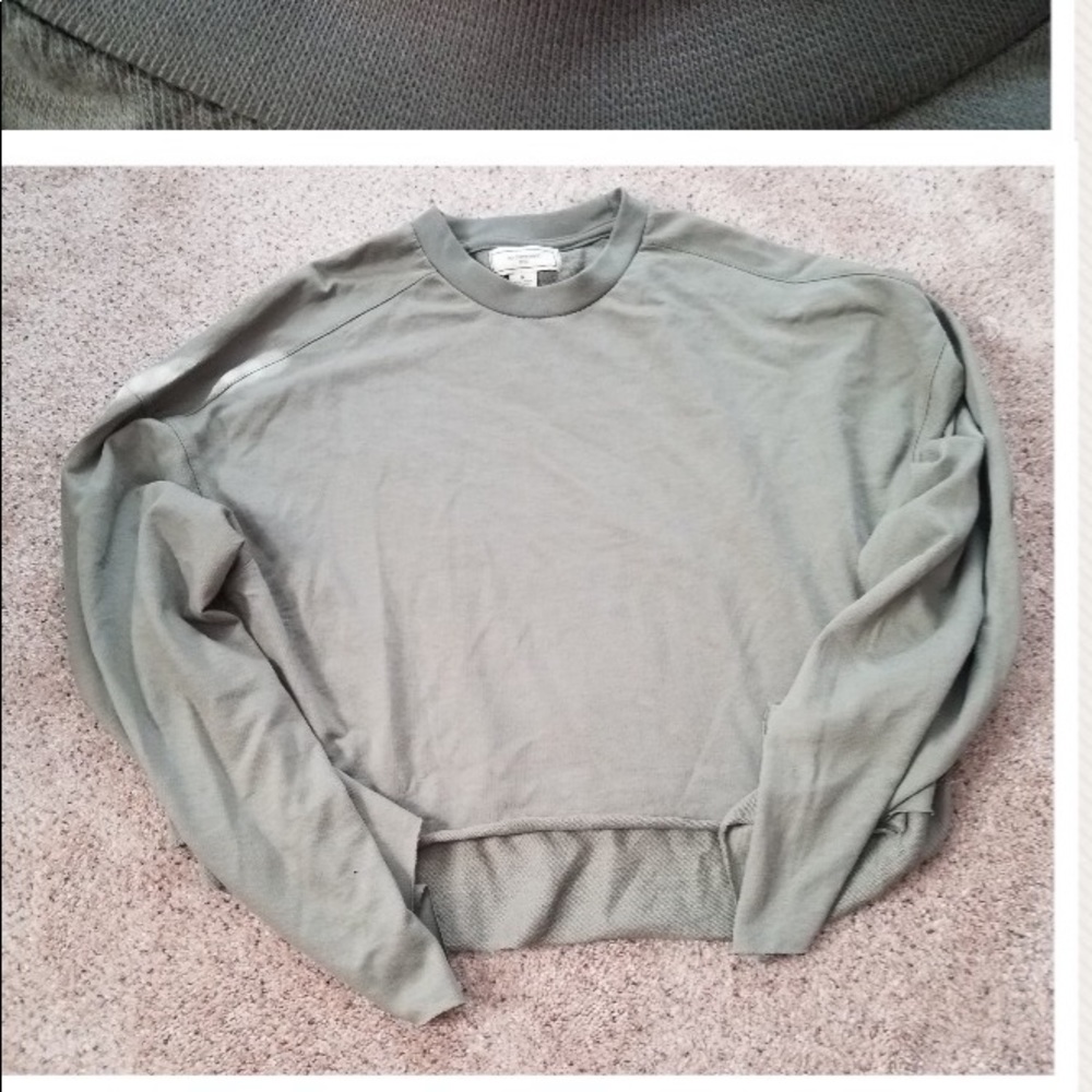 a cropped green hoodie